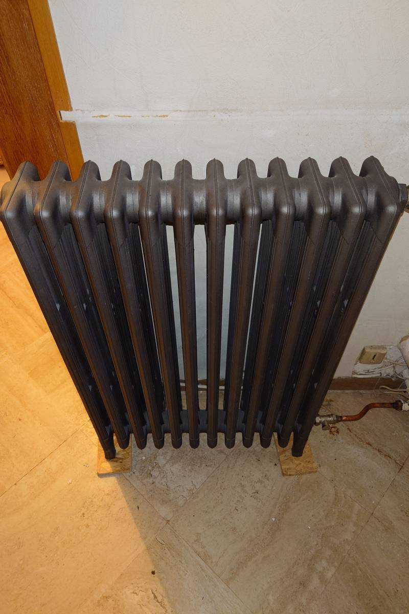 Faire déplacer un radiateur en fonte dans une maison près de Beauchamp dans le Val d'Oise